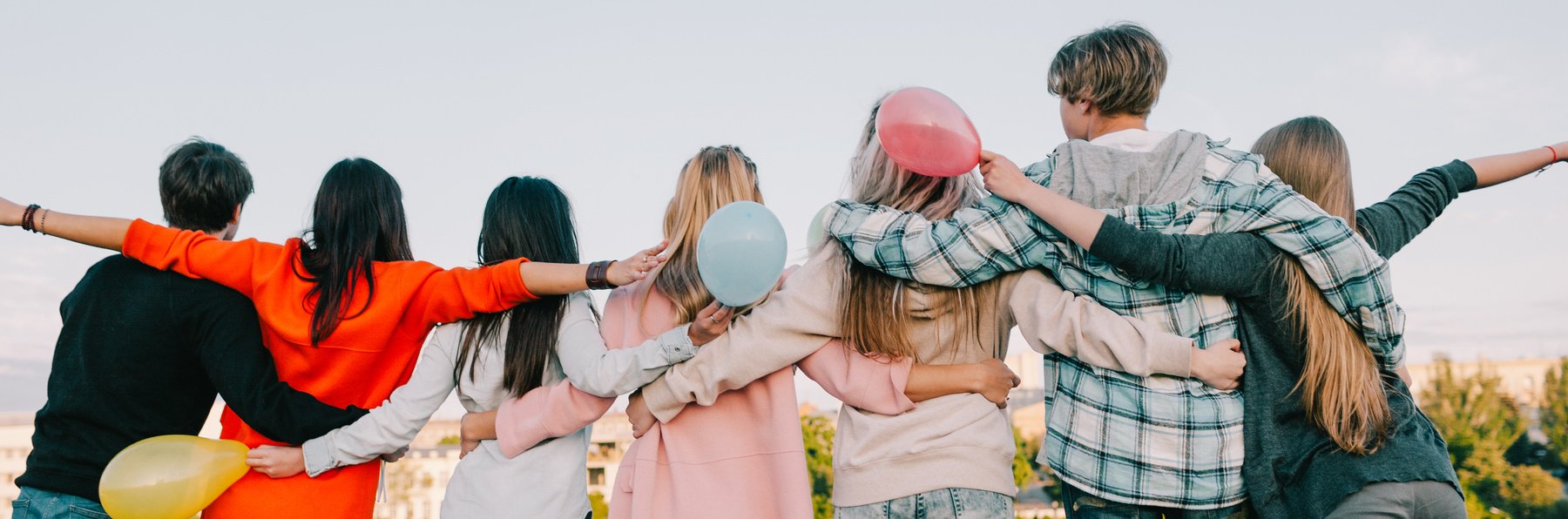 Young Friends Celebrating Outdoors with Balloons